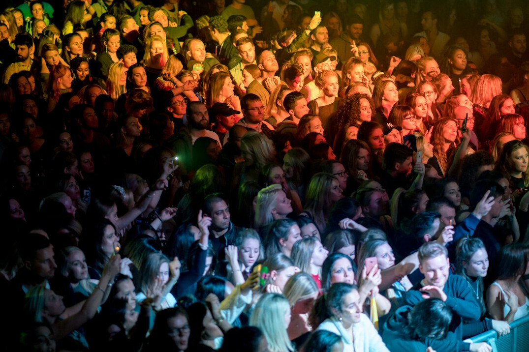 celebrity on stage with fans